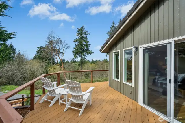 Private sitting area off the primary leads down to a hot tub just a few steps below.