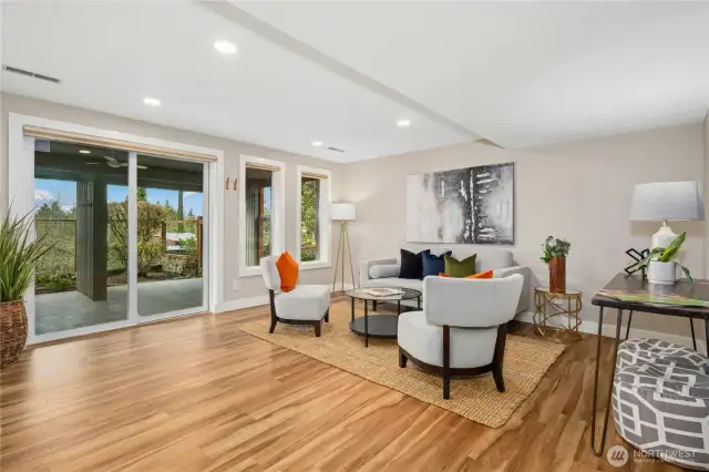 The lower floor offers yet more open space with this flexible lounging/entertaining space.