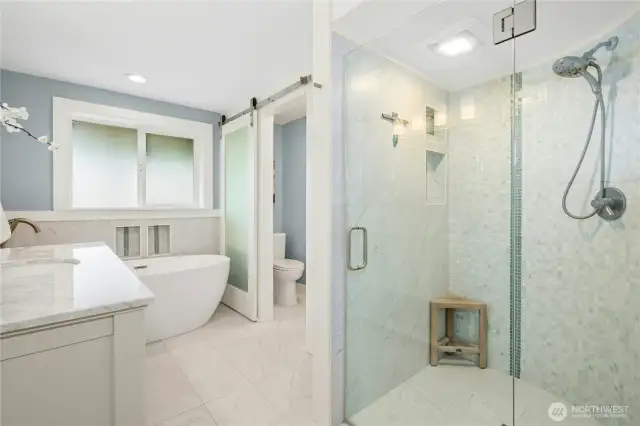 This elegant bathroom has a spa-like feel.