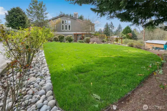 The stone patio gives way to this level lawn, perfect for croquet or badminton!