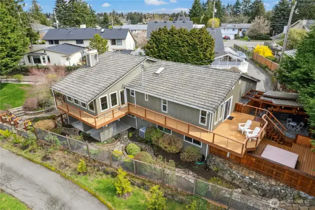 Tucked away from the street, the home faces a green belt, literally turning its back on the world outside. Roof material is concrete tile.