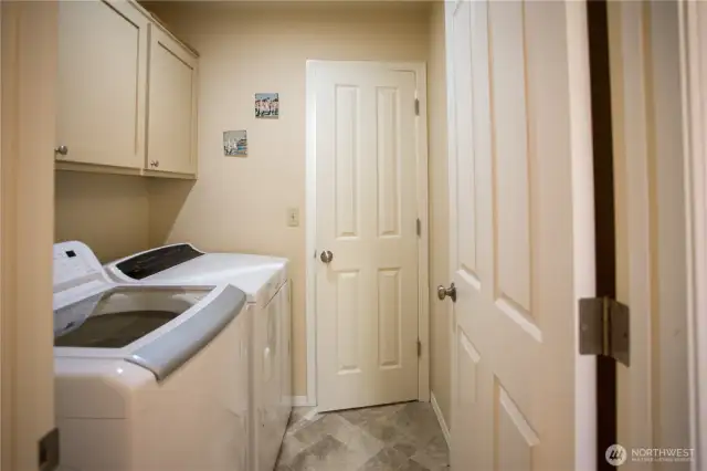 Laundry room sits right next to the primary bedroom for easy access.