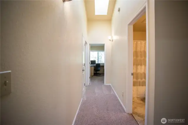 Skylights and vaulted ceilings amplify the space.