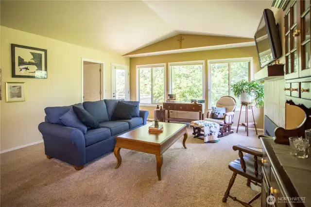 Enjoy a (mostly) private back deck overlooking the rhody bushes.