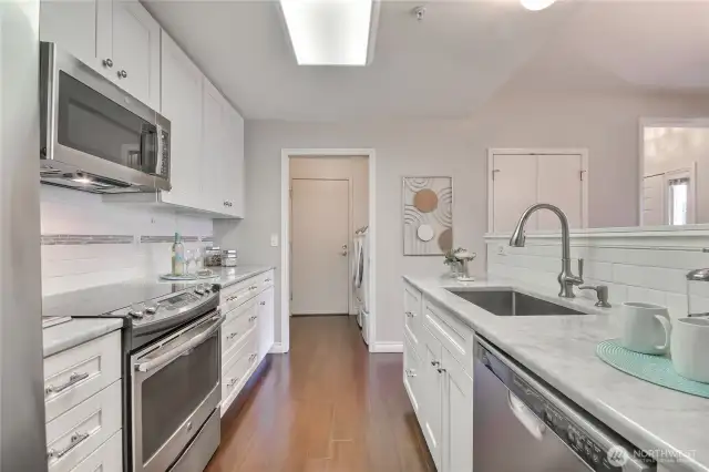 Walk-in laundry off kitchen. Door to garage.