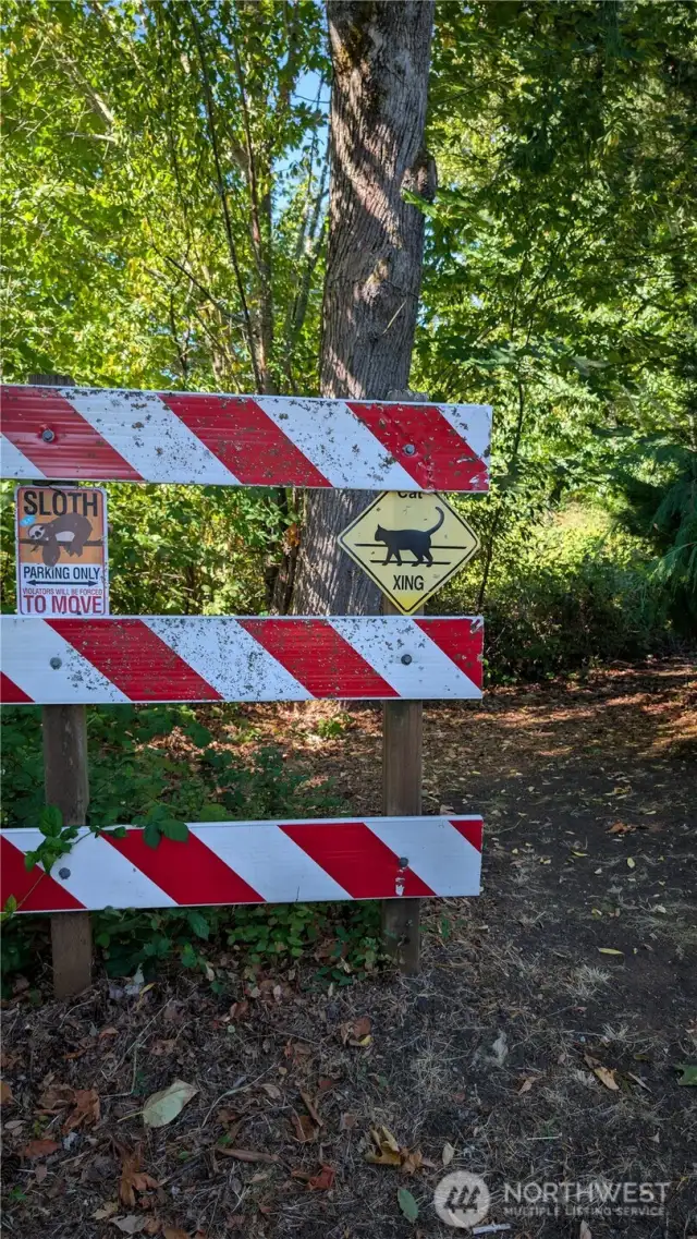 This is the dead end sign at the end of E Maryland. Walk down the path from this point and you will see the property corner marker.