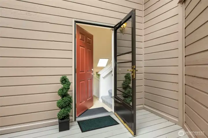 Step inside through a welcoming entry that opens to light-filled interiors.