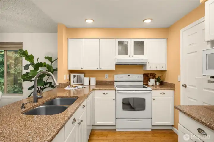 Enjoy a refreshed kitchen featuring generous storage, abundant counter space, and like-new appliances — ideal for everyday cooking and entertaining.
