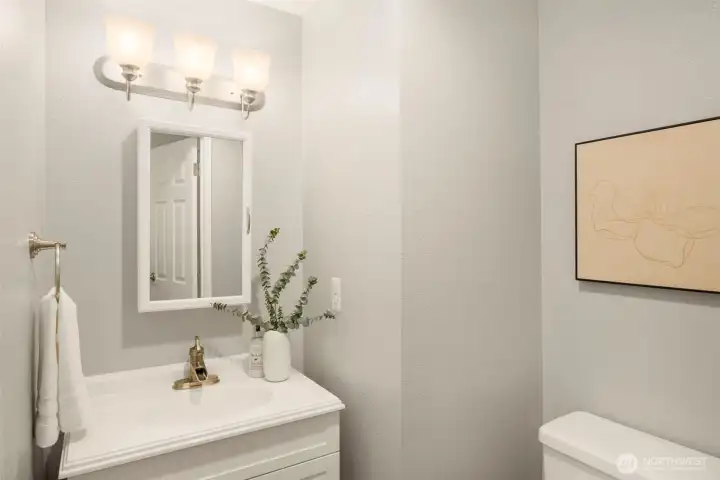 Beautiful updated half bath on the main floor — perfect for guests and everyday ease.