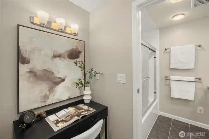 Flexible nook in the primary suite, ideal for vanity or desk use, with direct access to the dual-entry bath.