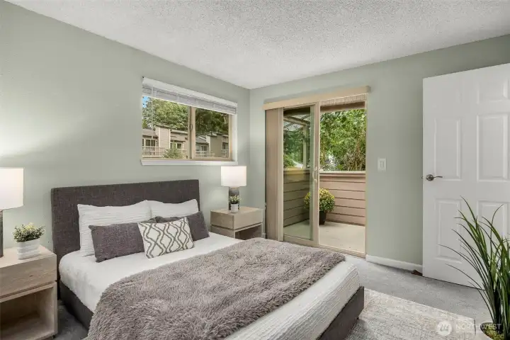 Bright secondary bedroom with direct access to a private deck — ideal as a guest retreat or home office.