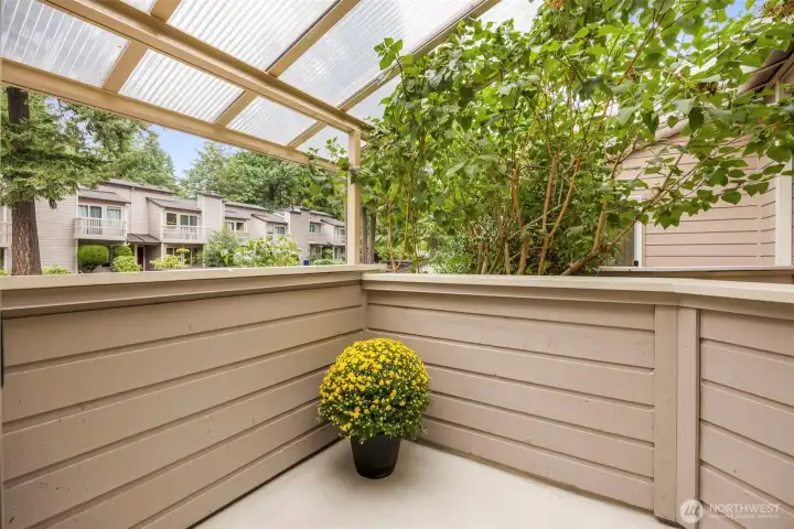 Step out from the secondary bedroom to a cozy covered patio— ideal for morning coffee or fresh air. Perfect for year-round use.