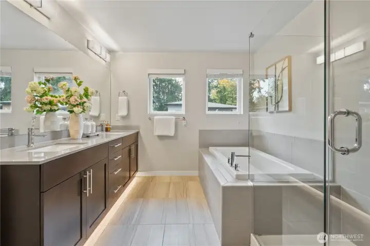 Primary bathroom with shower and bathtub.
