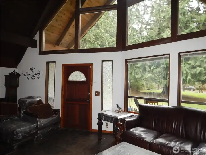 Three story windows on the front of the home