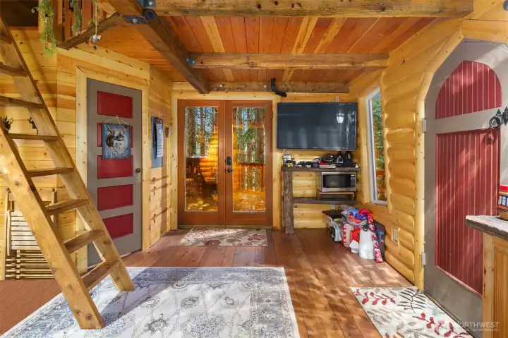 Ladder to loft bedroom, TV and in place for entertainment on rainy days.