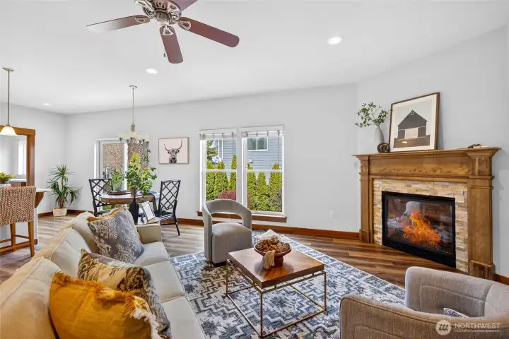 Cozy gas fireplace with wood mantle, fresh new flooring throughout.