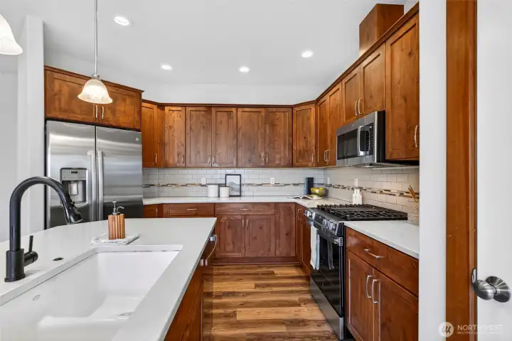 Brand new stove, built in microwave and fridge.