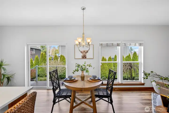 Lots of large windows for light and glass sliders just off the great room access the private backyard space.