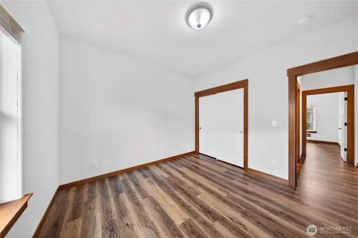 View of second bedroom with double door closet.