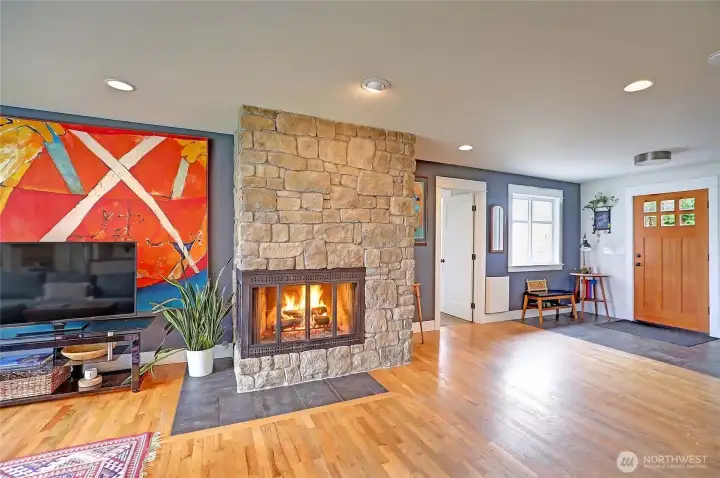 Masonry wood fireplace with propane igniter