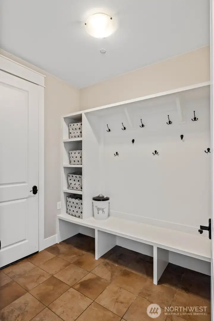 Mud room outside of 2 car garage