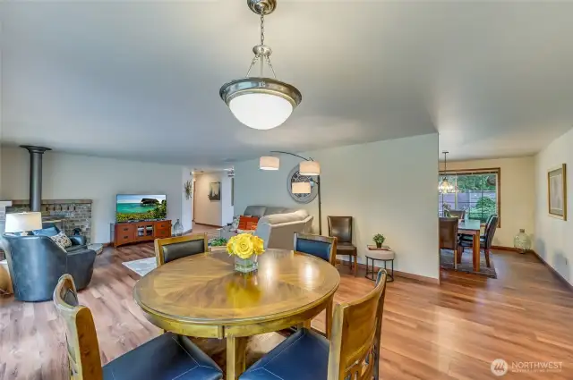 informal dining open to family room, kitchen & beautiful deck
