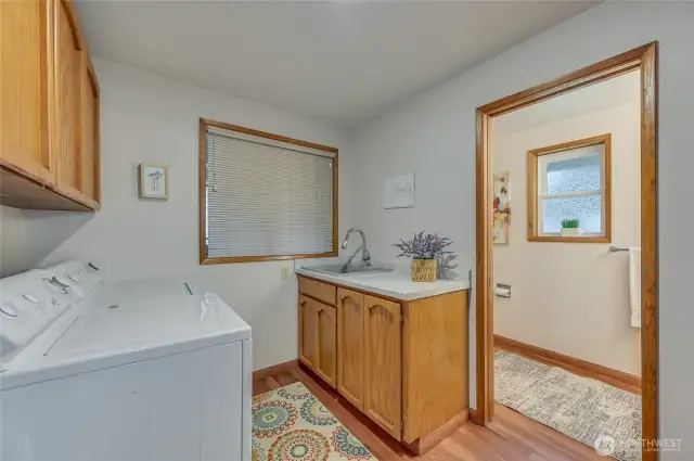 WOW that's a big laundry room, adjacent bath
