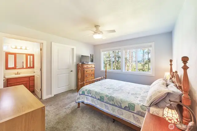 Primary bedroom with a view of Willapa Bay and walk-in closet