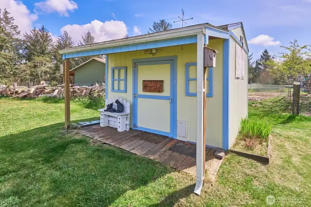 His/her/they shed in the front yard, could be an art or yoga space or...?