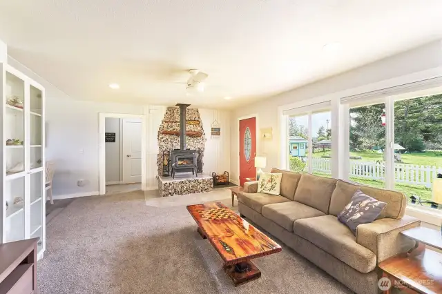 Living room has a woodstove to keep the house warm and dry in the winter months