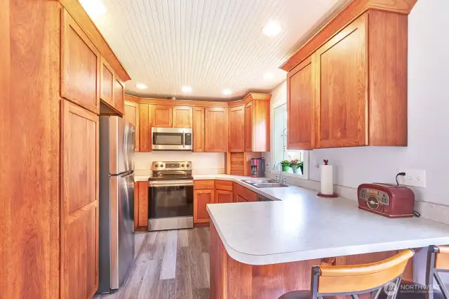 Beautiful cabinets and almost new appliances in this well-planned kitchen