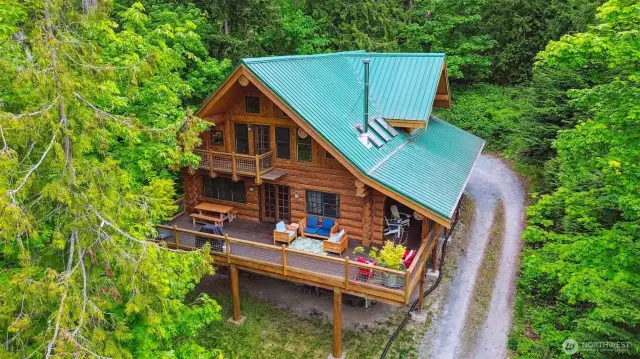 Welcome to 1465 Magnolia Lane. A 3,196sqft  3 bed, 2 bath log home plus 1,152sqft cabin and shop on 2.6 scenic acres.