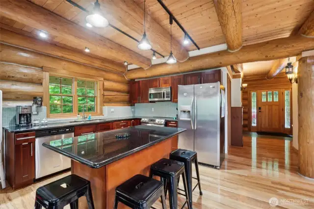 Beautiful ceiling beams throughout including the open concept kitchen.