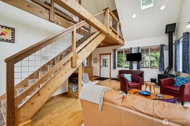 The living room looks out over the deck and has access to the upstairs loft.