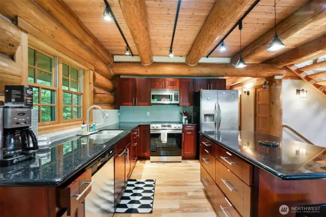 Beautiful ceiling beams throughout including the open concept kitchen.