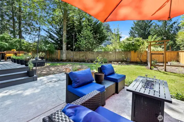 The Trex composite deck is adjacent to the stamped concrete patio.