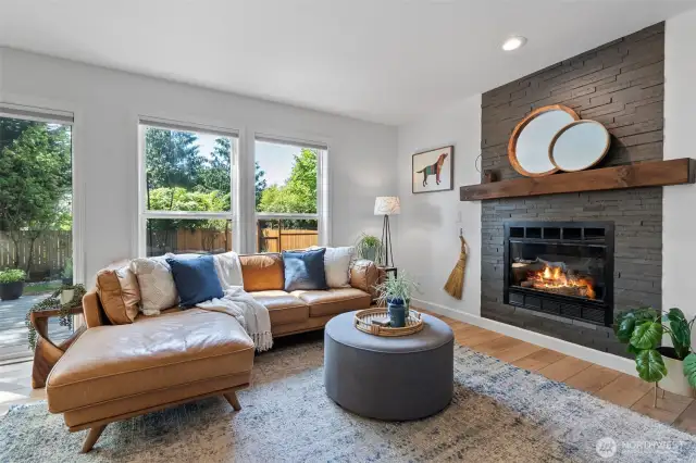 The family room has large windows looking out over the stamped concrete patio.