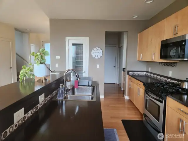 Views of the entry, pantry and butler's pantry which also leads to one of the garage spaces.