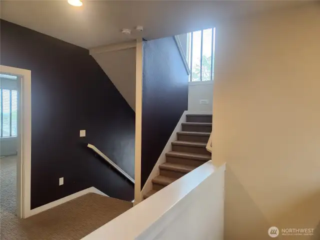 Stairs on left of photo coming from the main floor, stairs to the right of the photo lead to the roof top deck with breathtaking views.