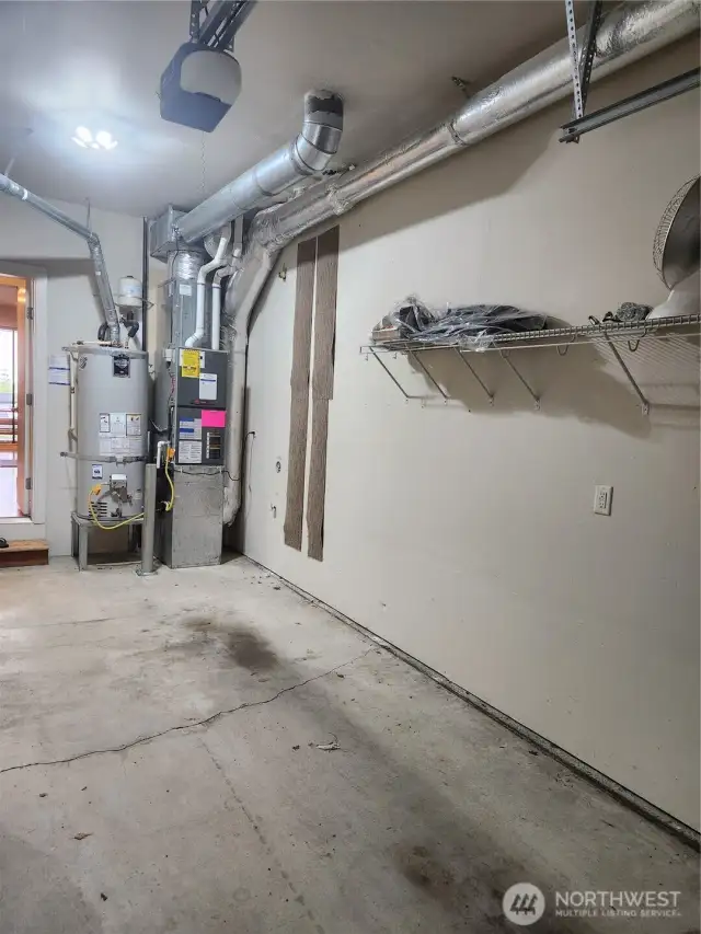 Water heater and furnace in garage.