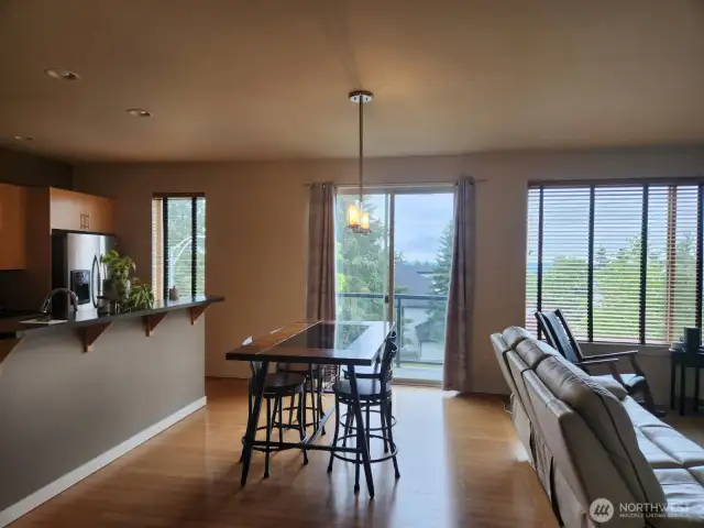 Carefully arranged furniture allows plenty of room for a dining table.  Family gatherings are easy to host in this space.