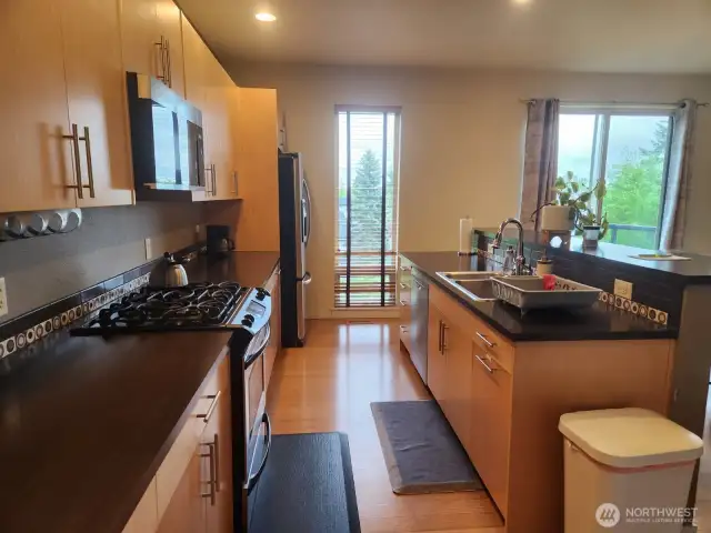 The kitchen boasts extensive and functional cabinetry.