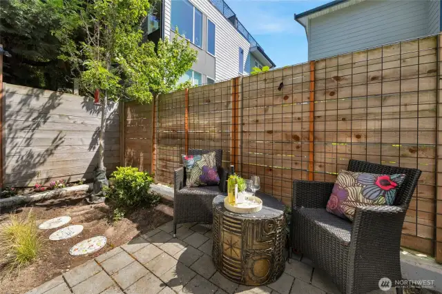 Fully fenced back patio and garden area which can be accessed from inside or from the front.