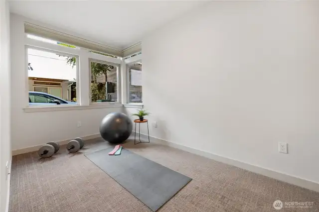 Front Bedroom two on the Main also has double closets. Has been used as a bedroom, office before, and workout room.