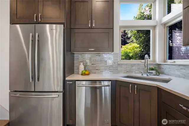 Wide and deep recessed stainless steel kitchen sink.