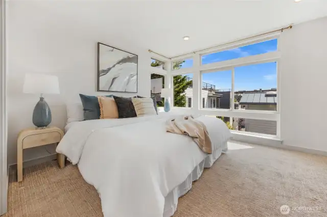 Upstairs primary suite has this level all to itself.  A wall of windows with nice views to the east and southeast.