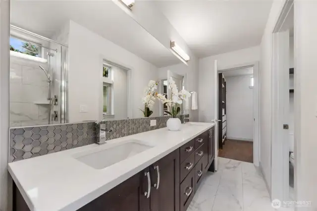 View to the back walk-in closet and the private commode to the right.