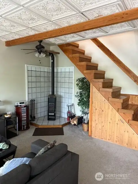 Woodstove in living room, under staircase to upper floor