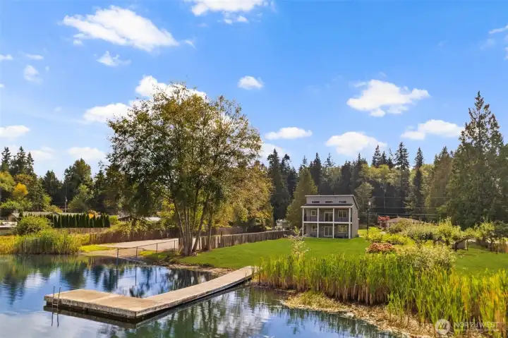 Situated on a rare double lot w/ 147 feet of private Lake Ketchum shoreline!