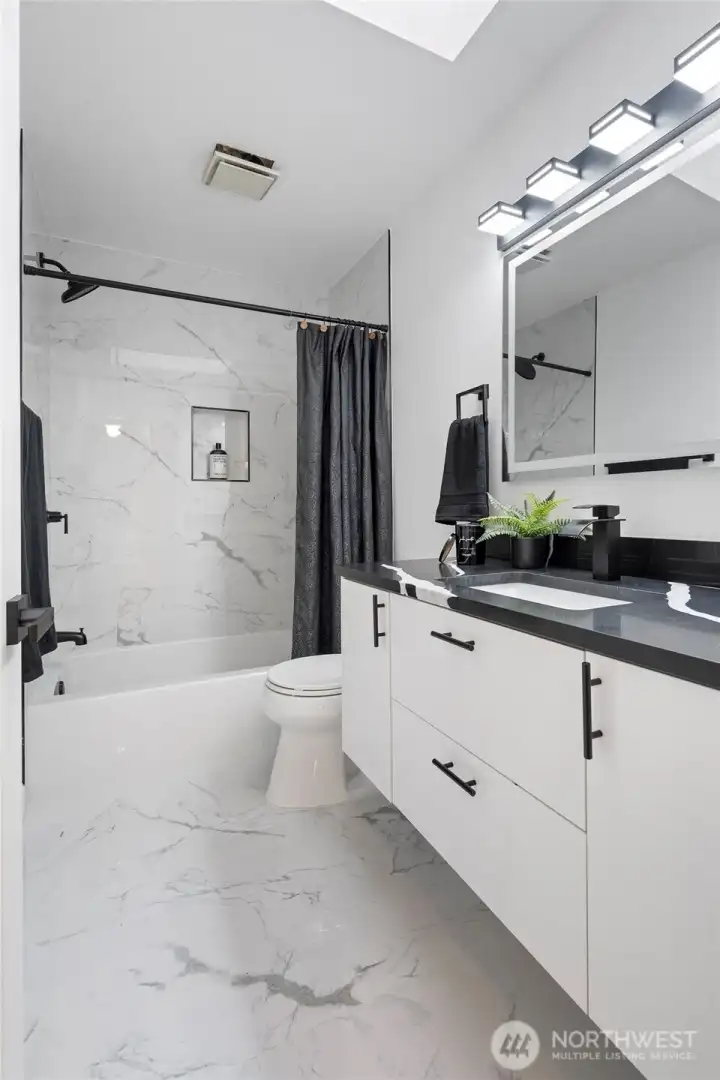 Hallway bathroom with tshower and a full tub